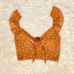 Ruffle Trim Tie Front Shirred Back
Crop Top